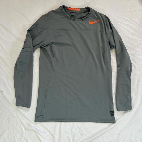 Nike Pro Hyperwarm long sleeve compression shirt in grey with orange Swoosh. - Picture 1 of 4